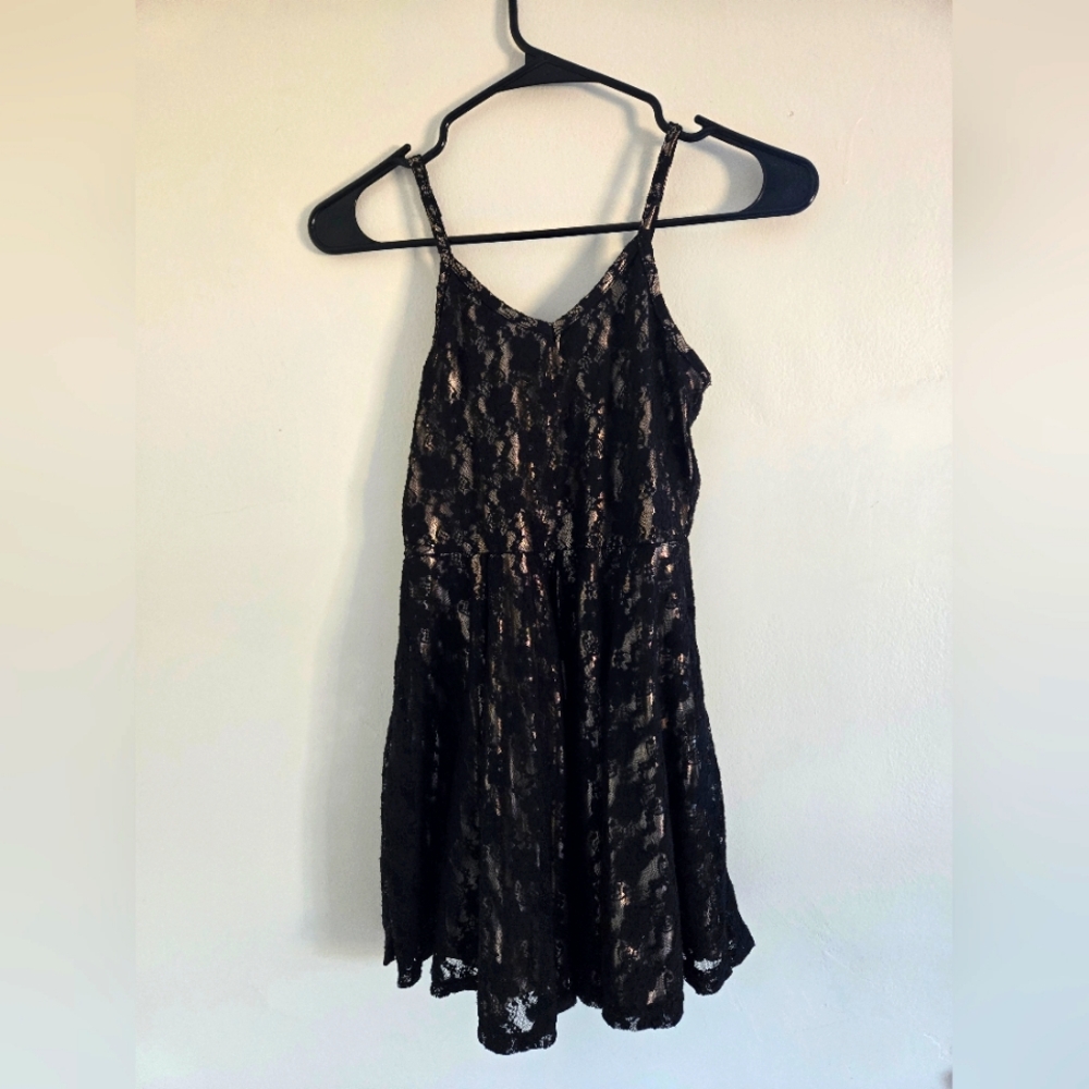 Black lace over gold dress
